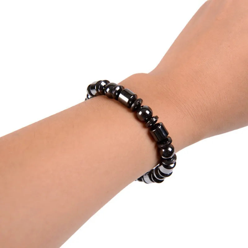 Black stretch bracelet with a pentagram stone, made from magnetite and hematite.