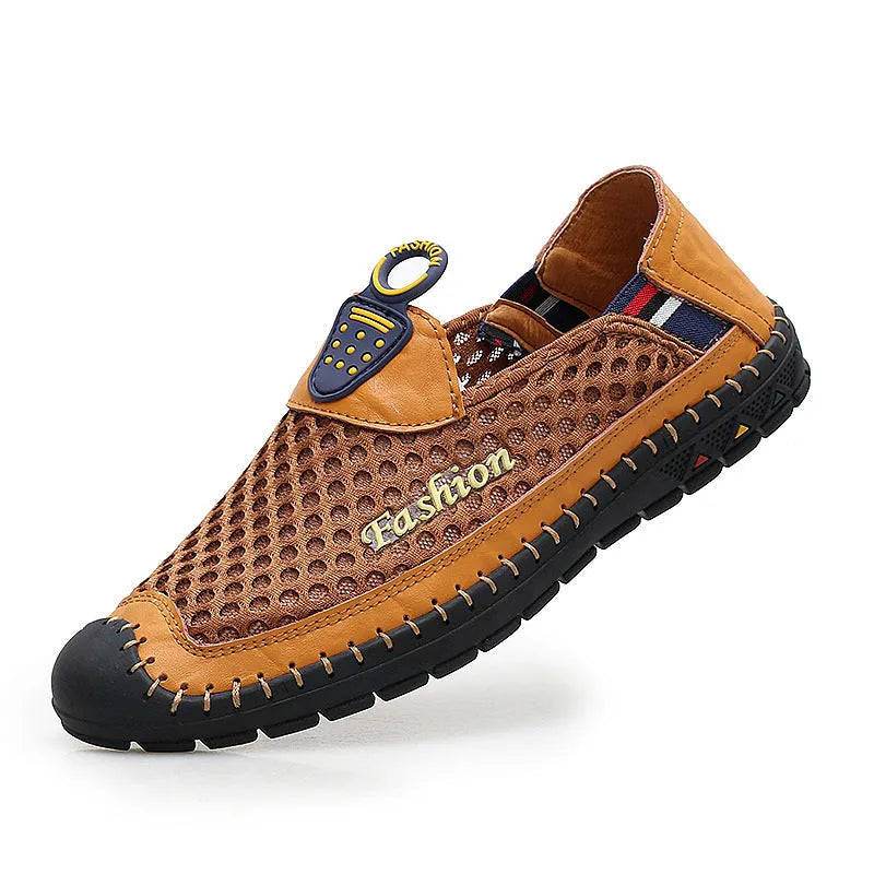 Men's brown casual shoes with mesh fabric upper and rubber sole, showing round toe and shallow-cut design.