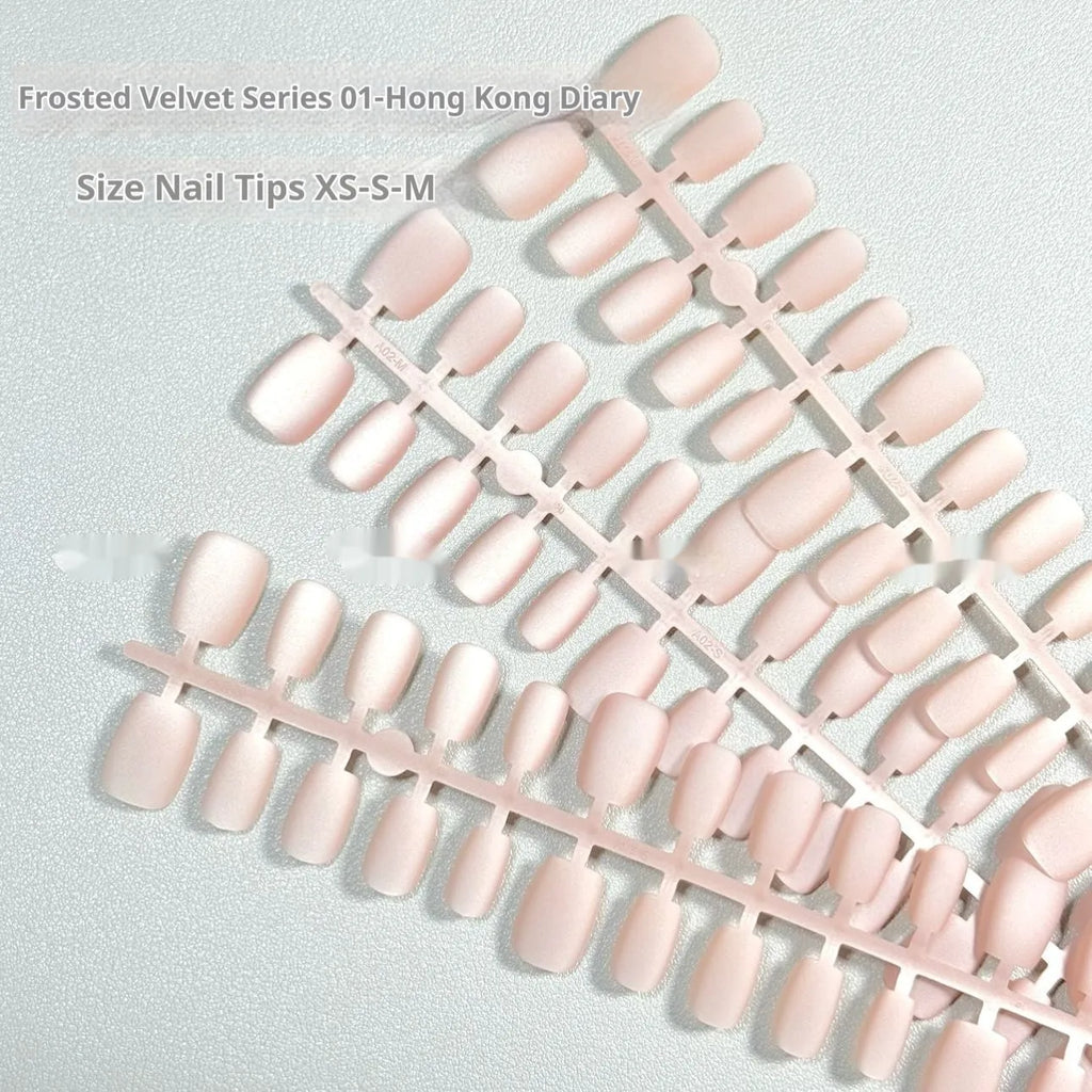 Set of frosted velvet Cat's Eye aurora style artificial nails in short ladder sizes on a clear background.