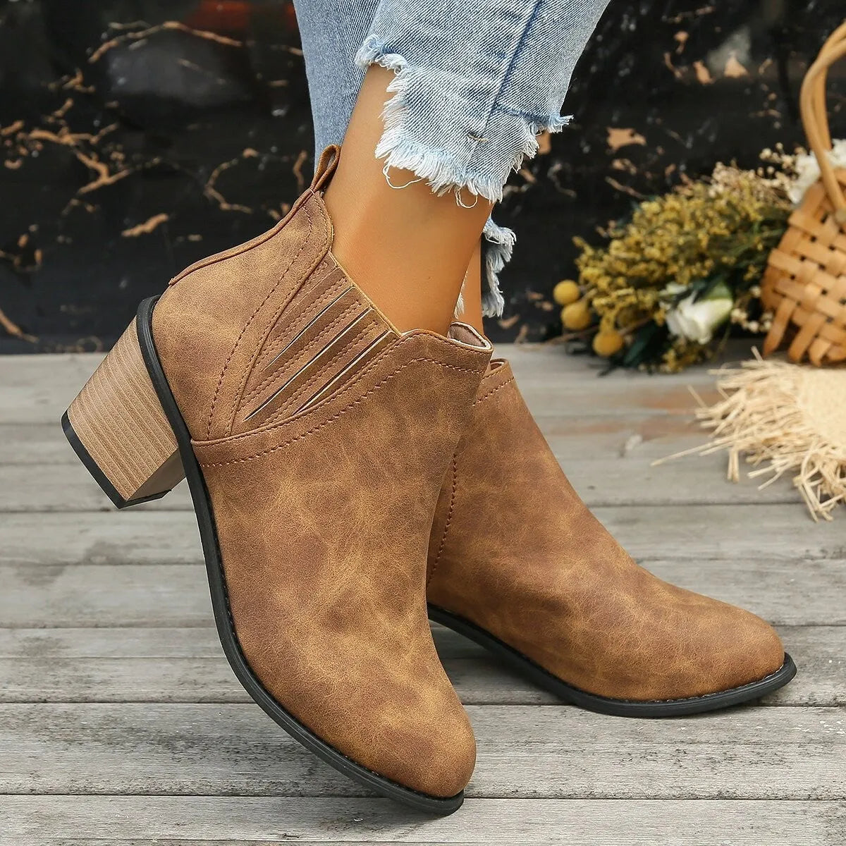 Women's black and brown pointed toe ankle boots with thick square heel and slip-on design made of artificial PU.
