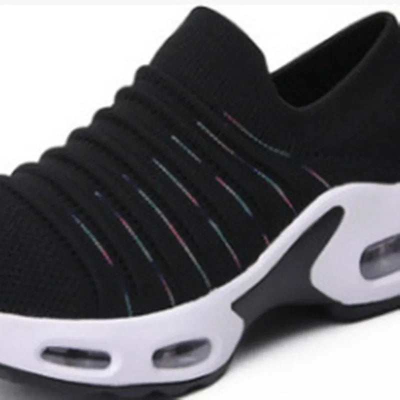 Women's stretch knitted socks shoes with mesh upper in dark blue colour showing round toe shape