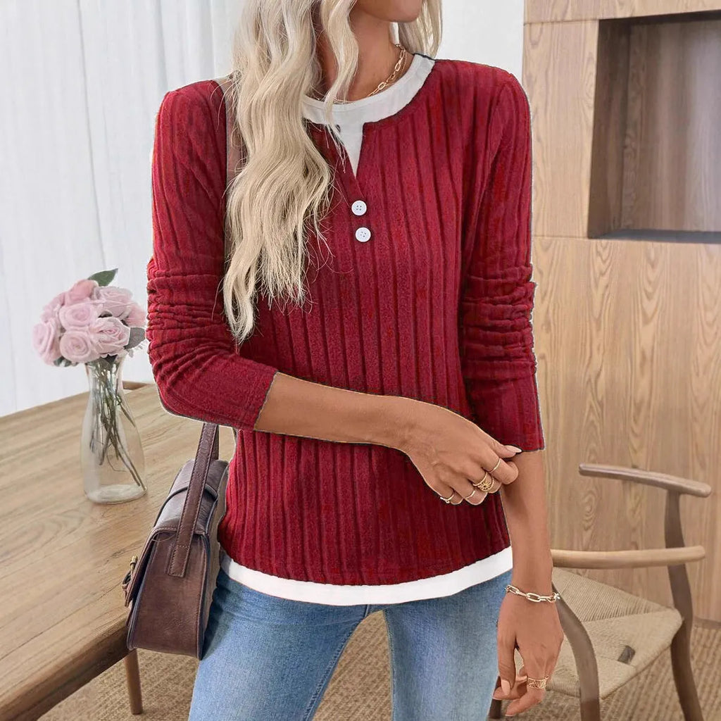 Women's black fake two-piece pullover sweater with a round neck and button front, showing concave stripe texture.