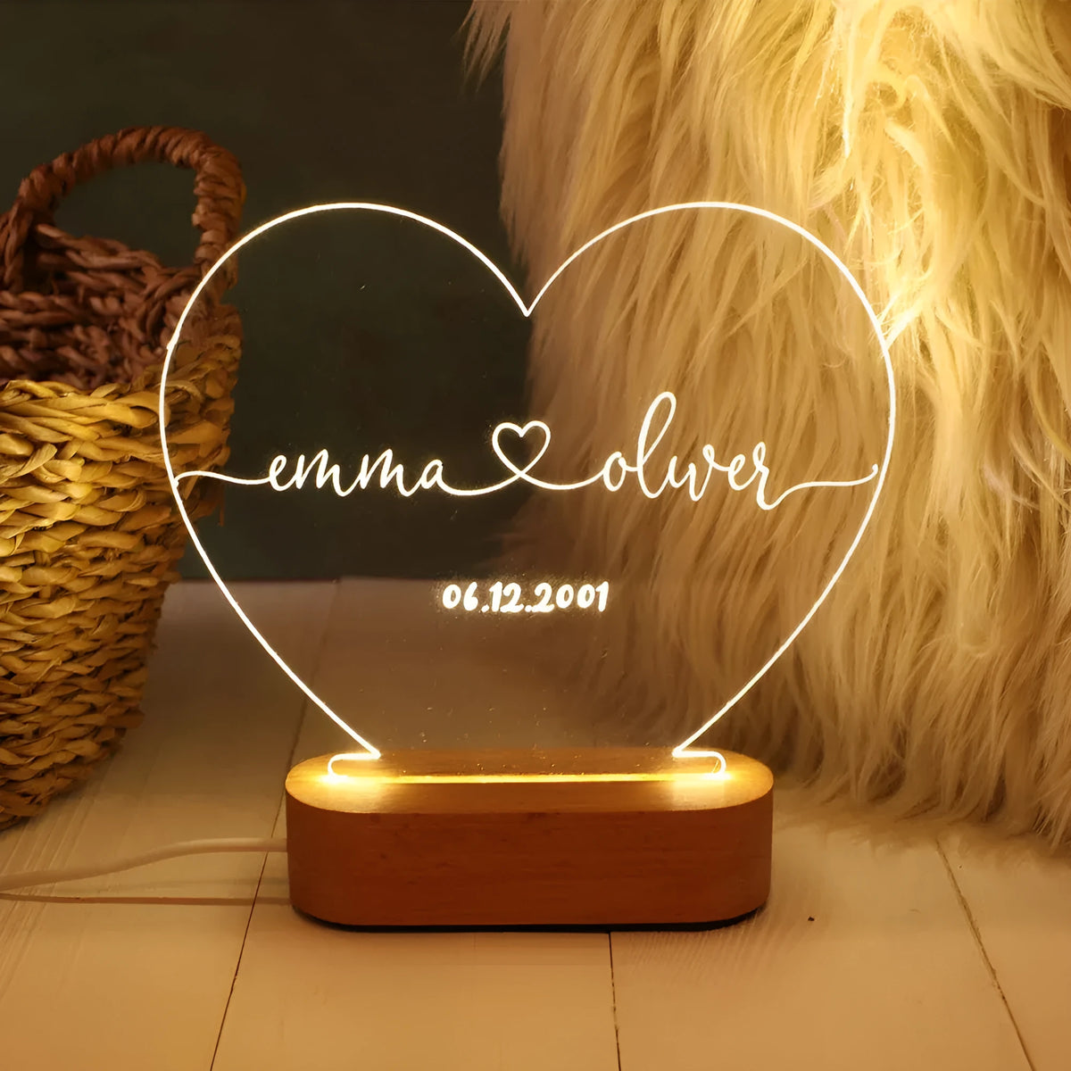 Personalised acrylic night light with engraved names and date, measuring 20cm by 11.5cm