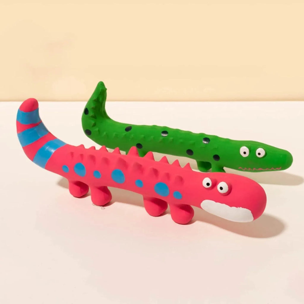 Green cartoon lizard shaped squeaky dog chew toy on a white background.