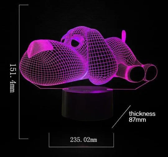 Doggo desktop lamp with 3D illusion design glowing in multiple colours on a desk.