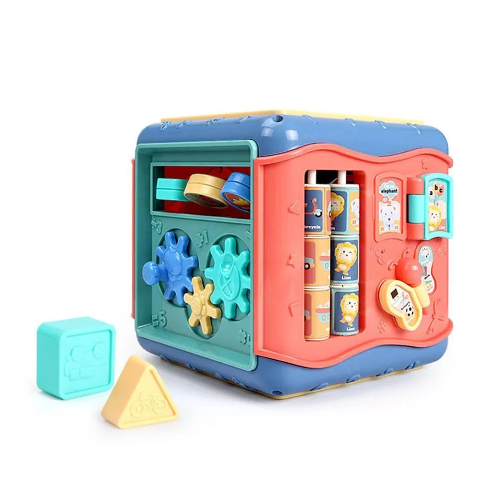 Colourful six-sided Montessori educational toy cube showing bead maze, gears, car track, clock, butterfly, and number activities