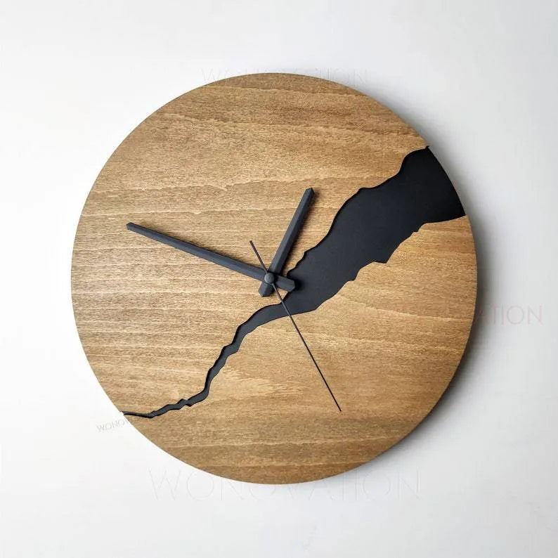 Modern wooden wall clock with a creative crack design on its face, shown in one of five available colour options.