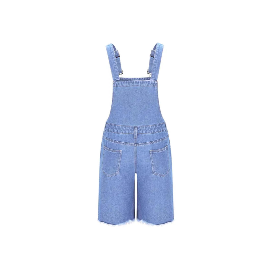 Men's ripped blue denim shorts with attached suspenders on a mid waist, straight-leg design.