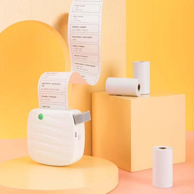 Three rolls of 57mm by 30mm thermal paper in an open box.