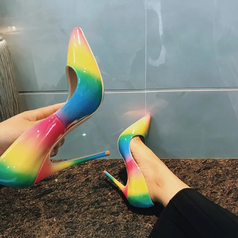 Rainbow multicolour patent leather women's stiletto heels with pointed toe on a white background