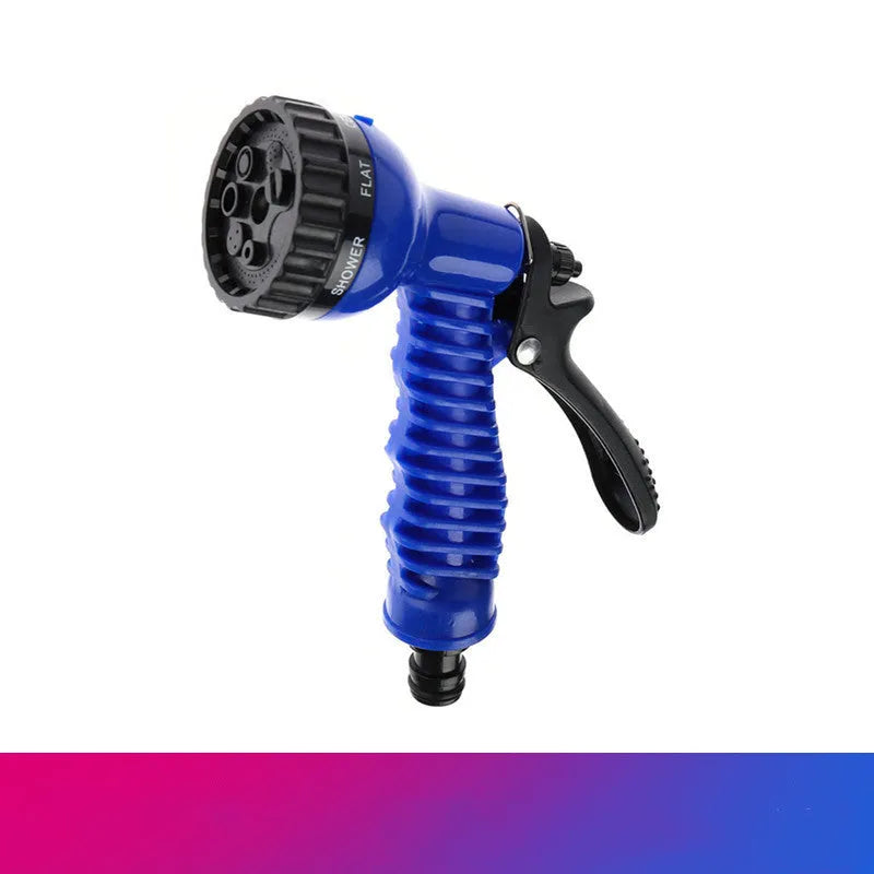 Garden telescopic hose sprinkler with ABS gun head extended on a lawn