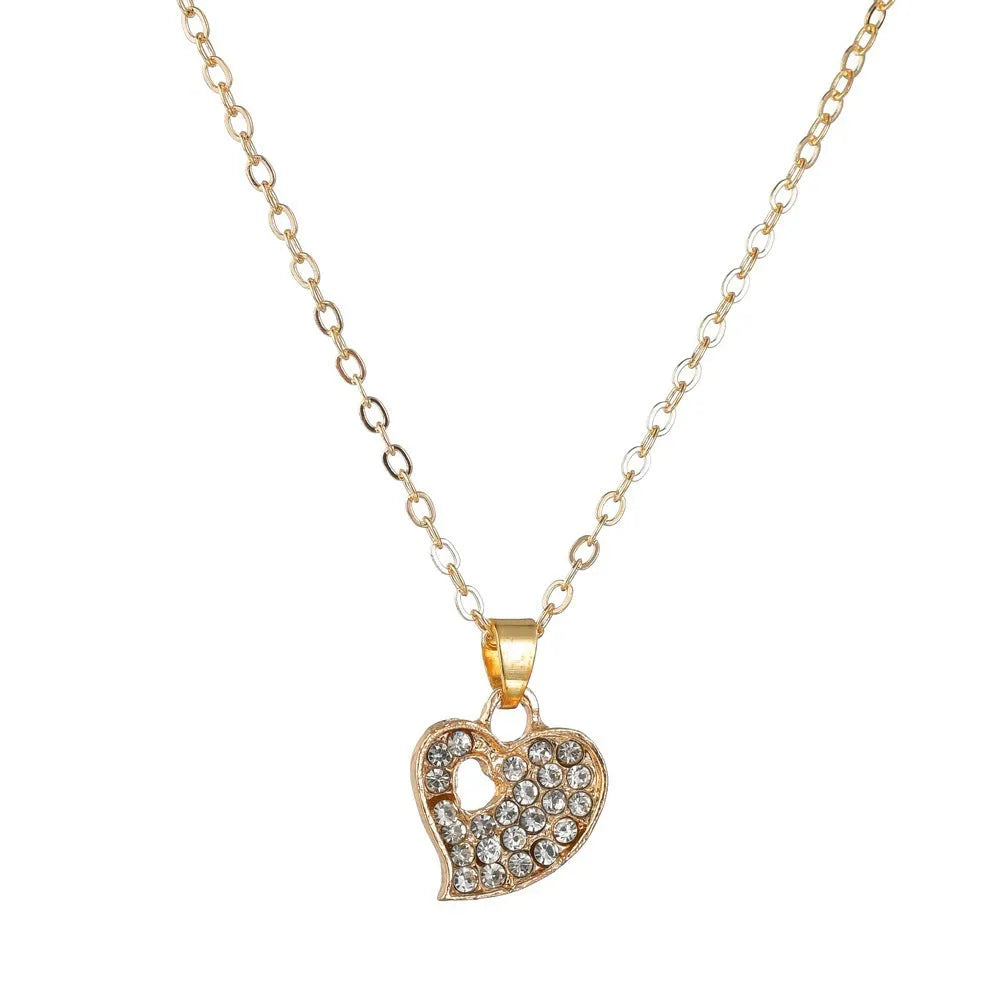 Gold tone women's love jewellery set with earrings, pendant and bracelet featuring adjustable 21-50cm sizing