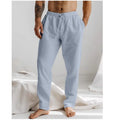 Men's light grey loose-fit summer trousers with a drawstring elastic waist and straight legs.