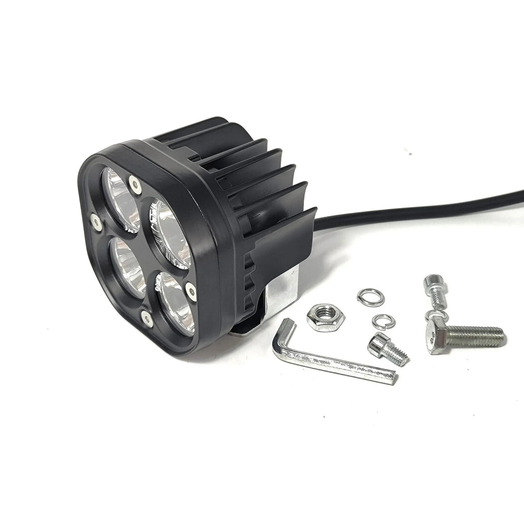 Four-eye clover spotlight headlight with aluminium base plate for vehicle modification.