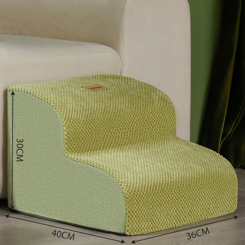 Brown foam pet ramp stairs with non-slip surface on a carpeted floor