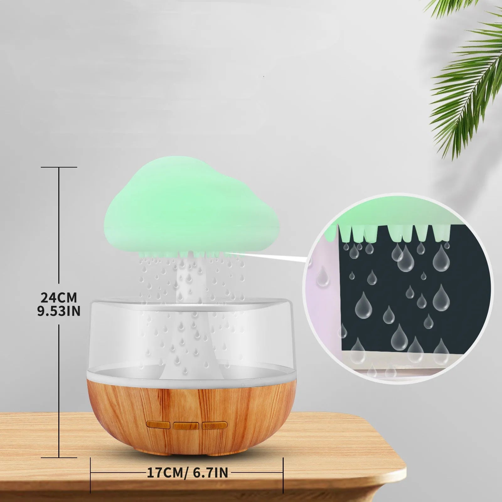 White cloud-shaped portable humidifier with coloured night light on a wooden table.