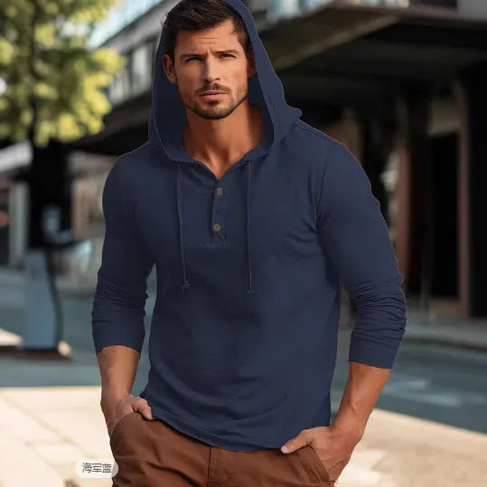 Man wearing a dark blue cotton pullover hoodie with long sleeves, showing front view.