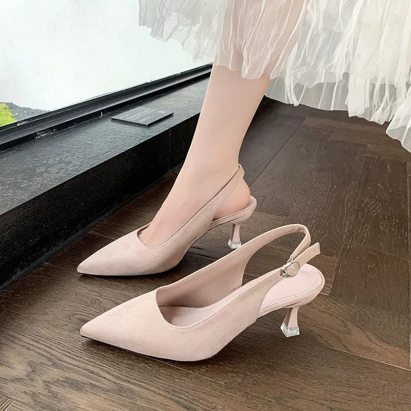 Women's apricot suede pointed-toe stiletto high heels on a light background.
