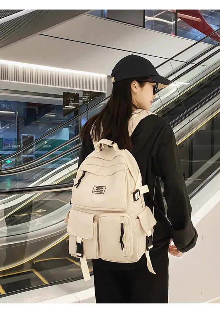 Soft nylon student backpack in black with laptop compartment and three-dimensional pocket