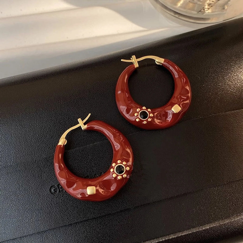 Hong Kong style retro ear studs with drip oil texture and rhinestone decoration in black and red colours