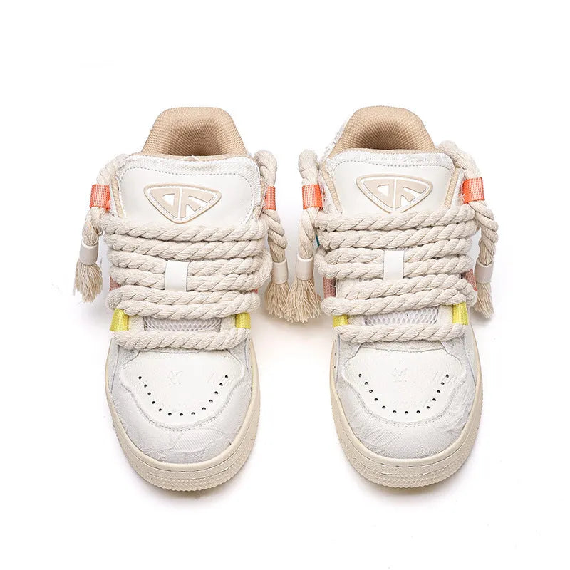 Creamy white retro skateboard shoes with lace-up front and platform rubber sole.