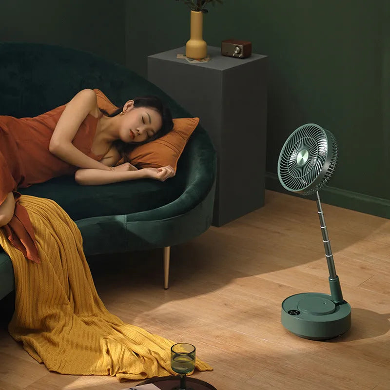Green and white telescopic rechargeable floor fan with remote control, shown in both desktop and extended height modes.