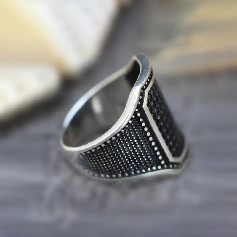Black alloy ring with copper-inlaid zircon detail showing European and American jewellery style