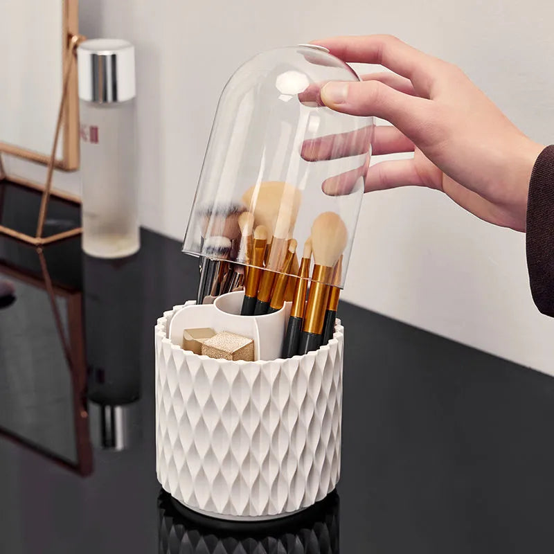 White transparent acrylic rotating makeup brush storage holder with dust-proof lid on desktop