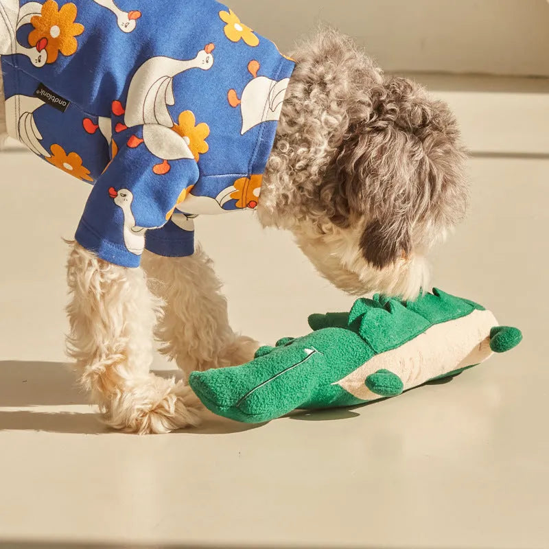 Green plush toy dog with interactive features, showing 35cm length.