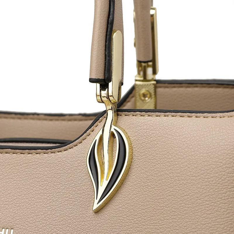 Women's black PU messenger bag with multi-layer shoulder strap and sewing thread detailing