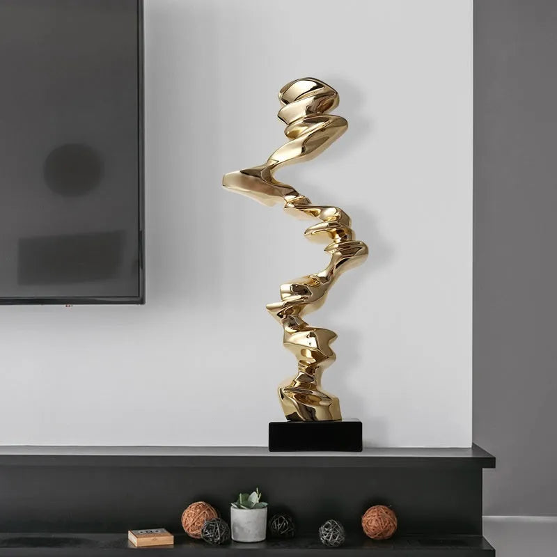 Modern minimalist abstract still life decorative ornament in gold, silver, or blue resin finish.