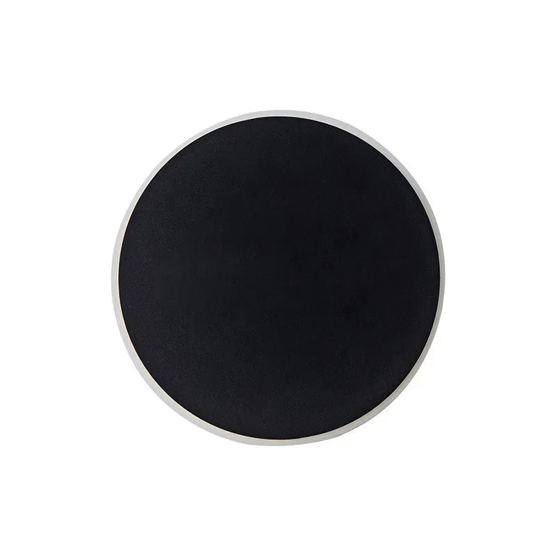 Round LED wall lamp 13cm diameter in black finish for bedside or corridor