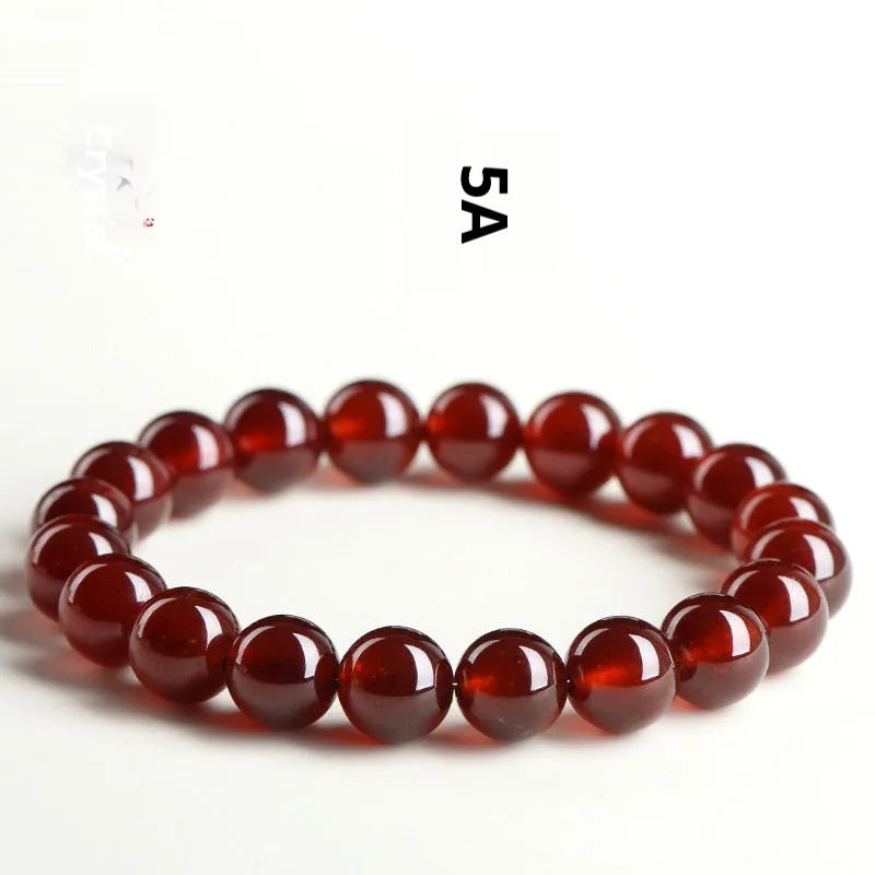 Crystal bracelet with natural orange red garnet beads and traditional Chinese ruyi charm in retro unisex design