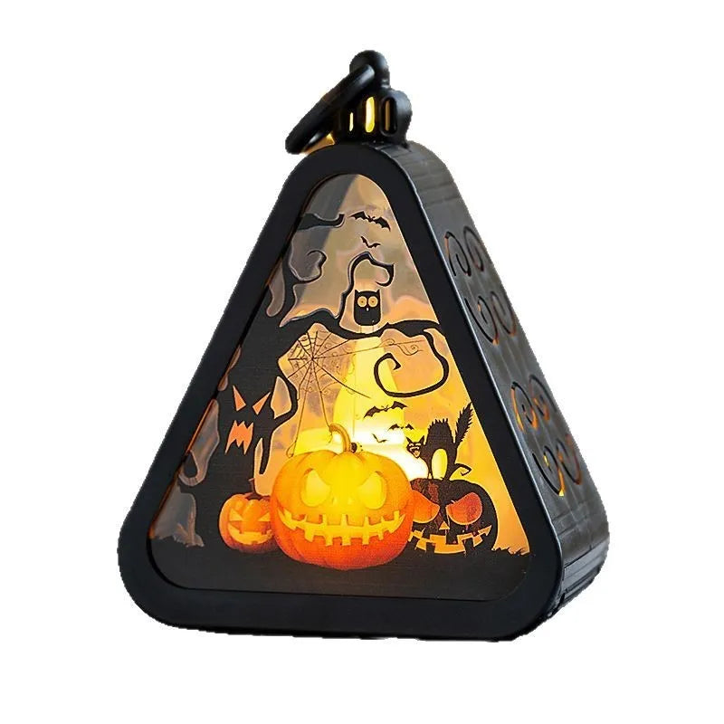 Halloween pumpkin lamp decoration prop showing plastic and glass construction in tabletop size