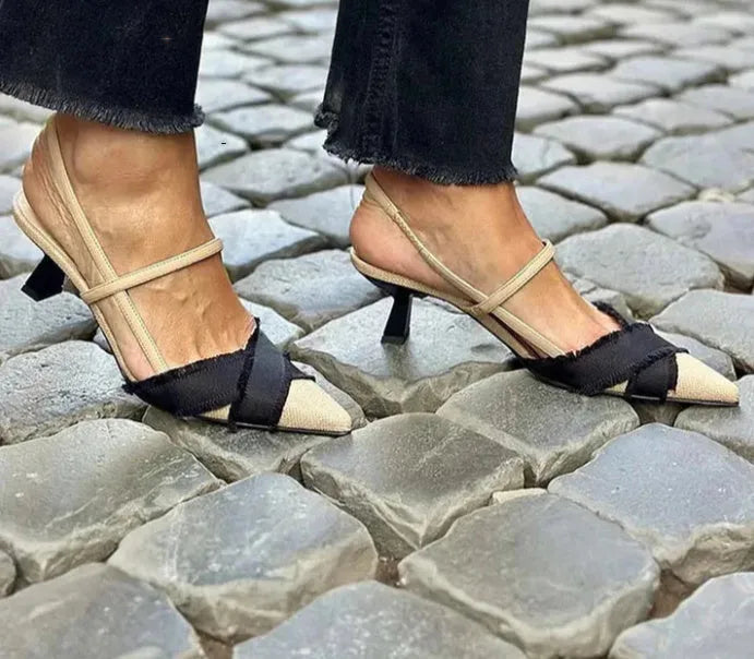 Women's apricot and black colour block stiletto heel sandals with pointed toe and ankle buckle.