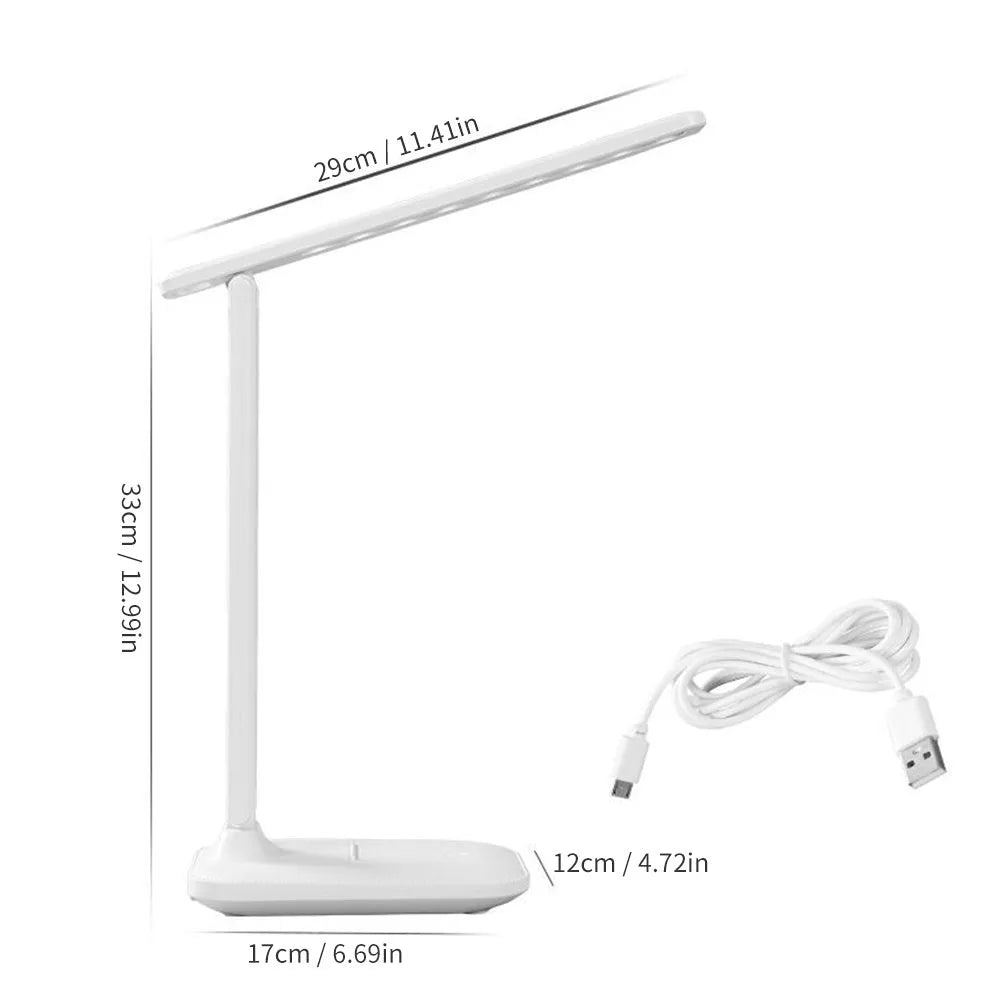 White plastic USB rechargeable bedside lamp with touch dimming control on a wooden surface.