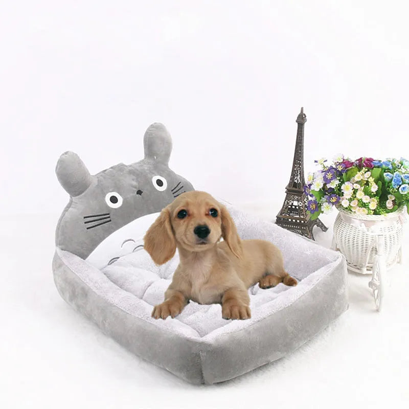 Cartoon-style plush pet sofa bed for small dogs and cats in blue colour, showcasing raised edges and non-slip bottom.