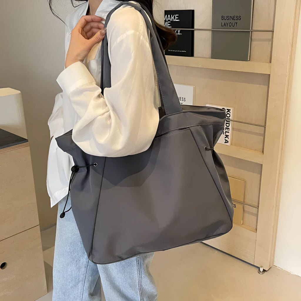 Soft Oxford cloth folding tote bag shown in multiple colours: black, brown, grey, and purple.