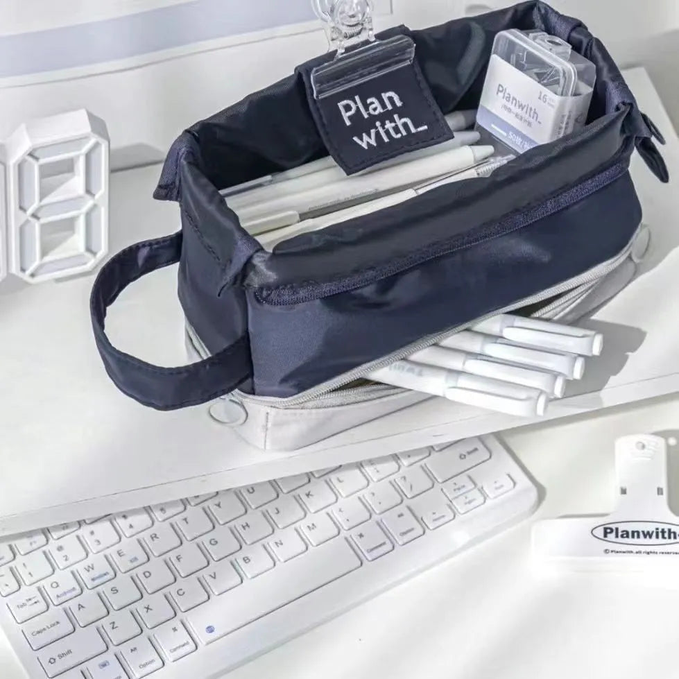 Folding double layer student pencil case in dark blue, blue, and cream white colours.