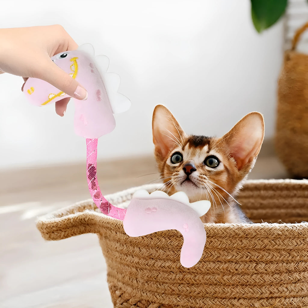Set of four colourful cat toys including rope, springs, and plush kickers on a white background.