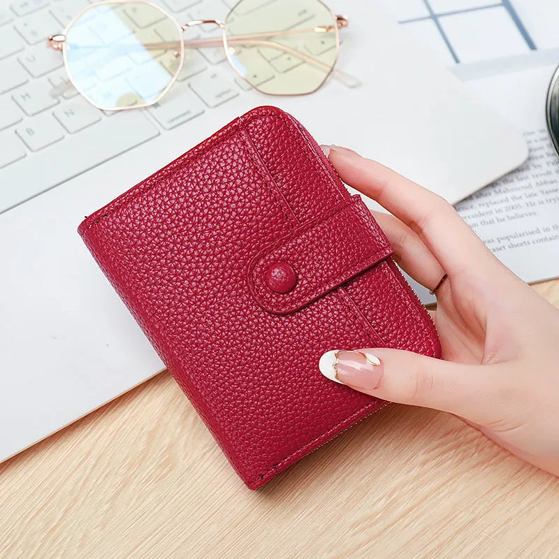 Ladies short wallet with lychee pattern texture in beige, pink, black, or red colours showing two-fold compact design