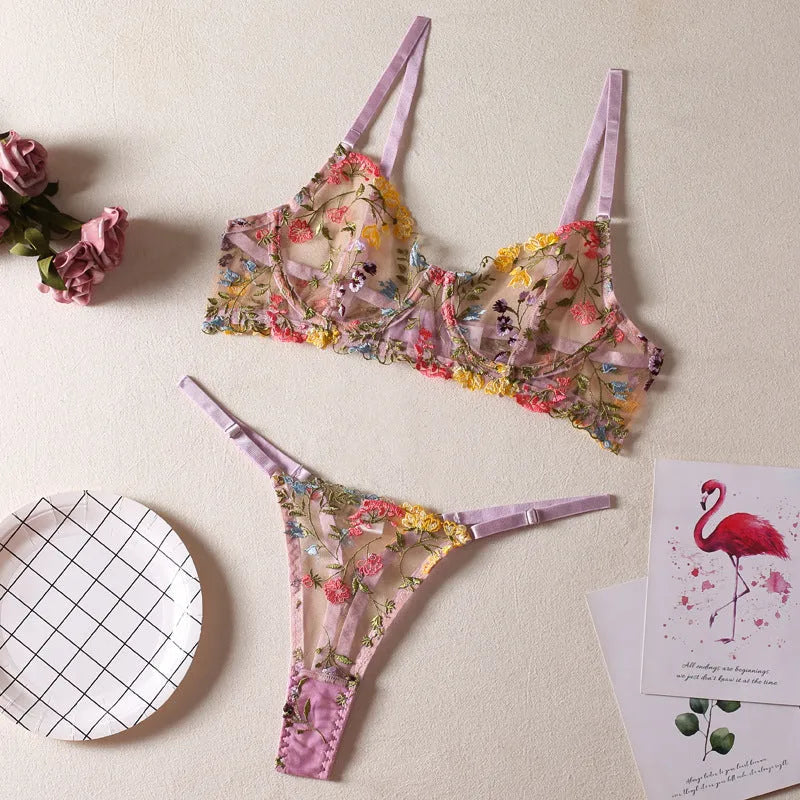 Floral patterned mesh bra and underwear set with a steel ring detail on the bra, shown in purple.
