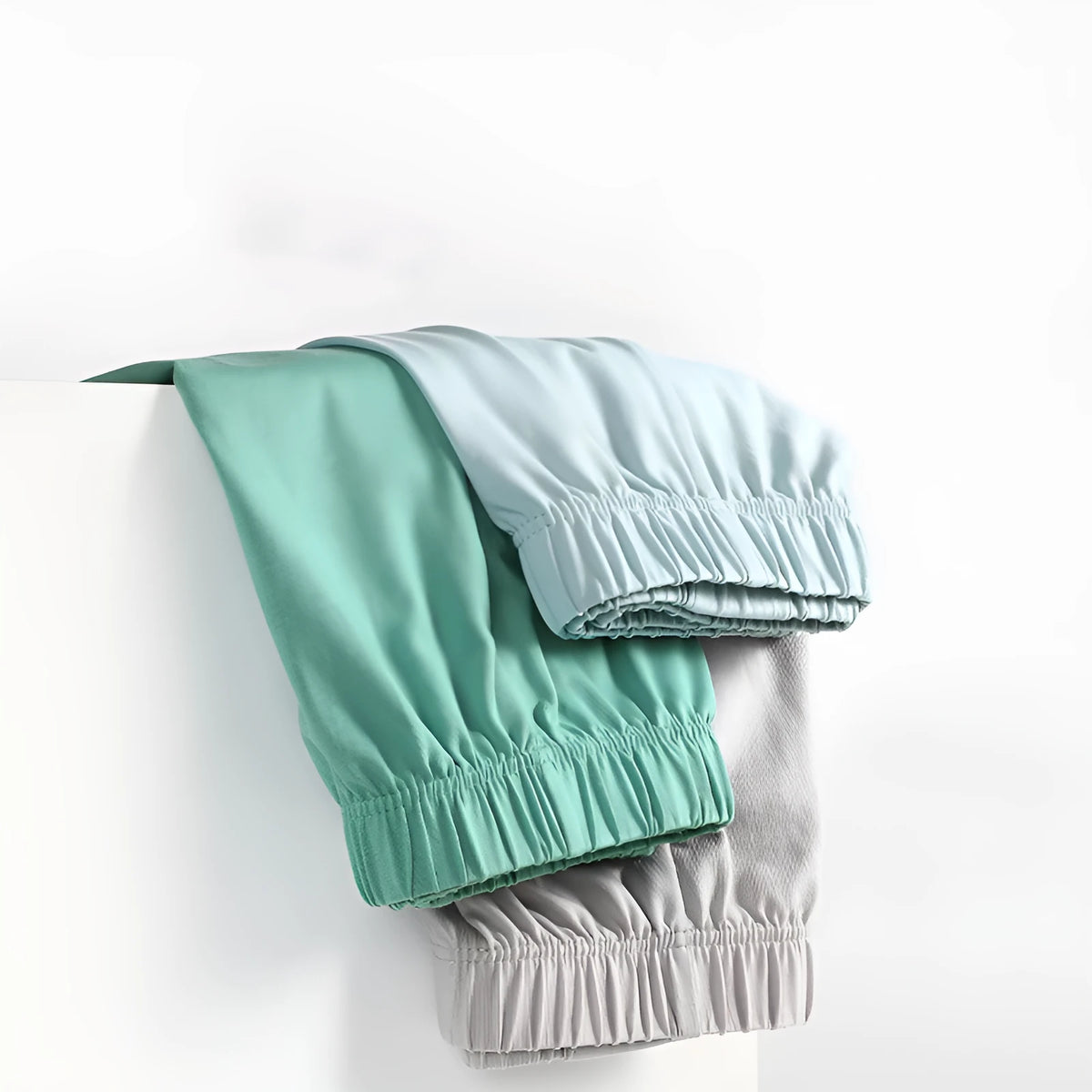 Men's loose-fitting cotton boxer shorts in gold, green, sea blue, and light grey solid colours.