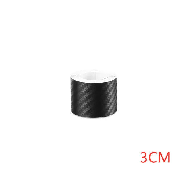 Close-up of matte black 3D carbon fibre pattern adhesive protection roll for car door sills