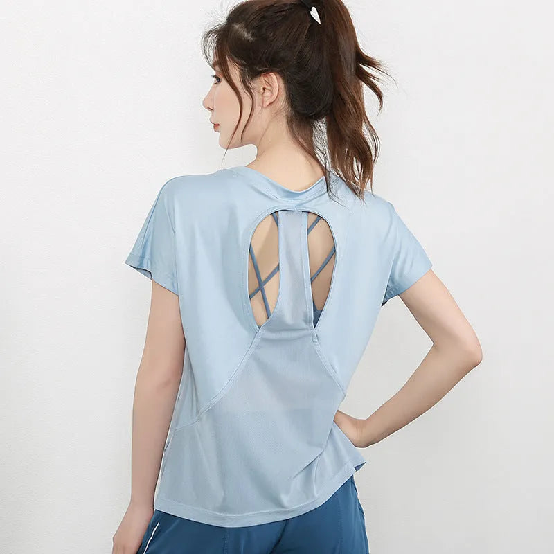 Women's short sleeve polyester sports T-shirt in black, shown flat.