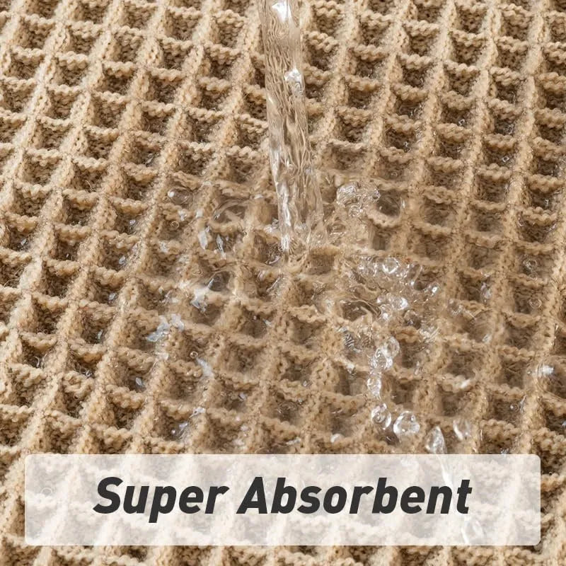 Checkered patterned non-slip absorbent bathroom floor mat in a neutral colour on tiles.