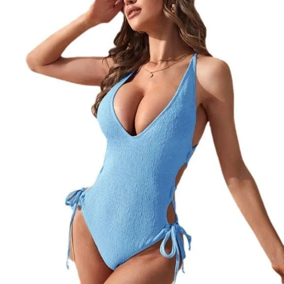Women's hollow backless tether bikini one-piece swimsuit in polyester fabric showing backless design