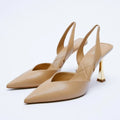 Apricot and black women's pointed toe high heels with patent leather upper and shallow mouth.