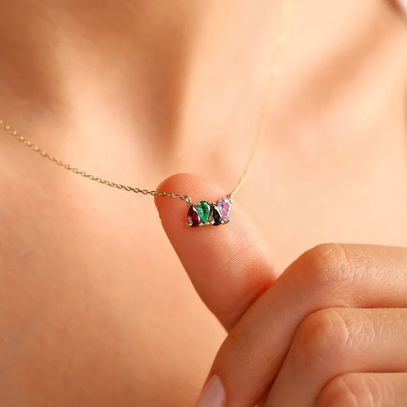 Zircon stone pendant necklace on clavicle chain in titanium steel with electroplated finish.