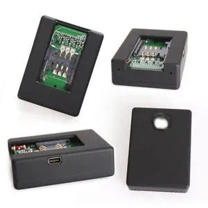 Black N9 mini GPS tracker and car alarm unit with open back cover showing SIM slot.